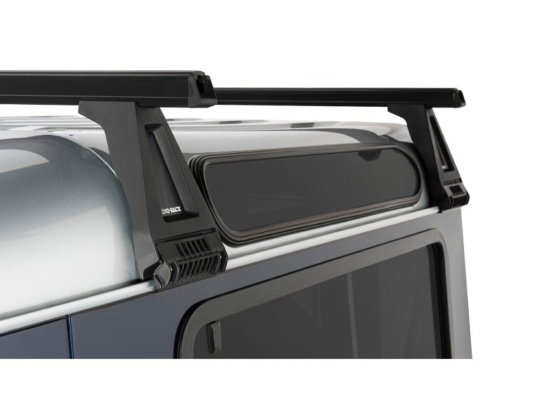 Kit 2 Dachträger-Querträger schwarz Heavy Duty 1500mm mit Füßen RL210 Land Rover Defender — Rhino Rack